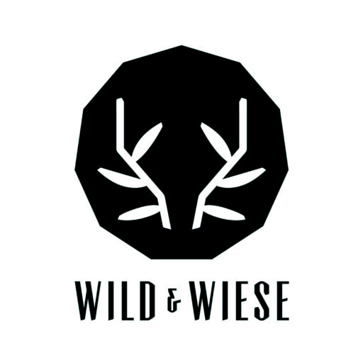 Logo: black shield with a white laurel design and the words 'WILD & WISE' beneath.